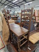 A PAIR OF OAK LADDER BACK CHAIRS WITH SOLID SEATS
