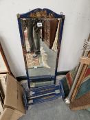 A BLUE CHINOISERIE DECORATED WALL MIRROR AND MATCHING ADJUSTABLE BOOK TROUGH.