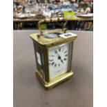 A COLLINGWOOD AND SON BRASS CASED CARRIAGE CLOCK.