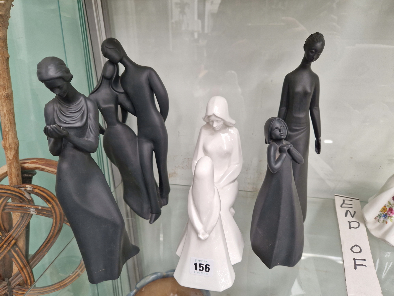 FOUR DOULTON BLACK BASALT FIGURES TOGETHER WITH A DOULTON WHITE GLAZED MOTHER AND DAUGHTER GROUP