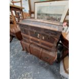 A CANVAS TRUNK TOGETHER WITH ANOTHER WITH A ROUND ARCH TOP, IRON AND OAK STRAPS