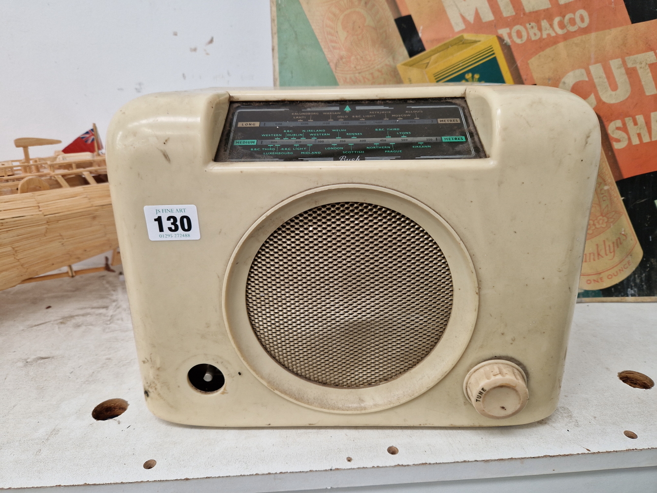 A BUSH RADIO IN A WHITE BAKELITE CASE.