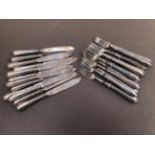 TWELVE HALLMARKED SILVER FISH KNIVES AND FORKS WITH FILLED HANDLES. GROSS WEIGHT 1397grms.