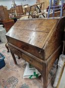 A GEORGE III OAK BUREAU ON A STAND WITH TWO SHORT DRAWERS. W 89 x D 52 x H 95cms.