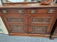 AN EDWARDIAN MAHOGANY SIDEBOARD WITH CARVED PANEL DOORS