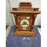 A WALNUT CASED WURTEMBERG MANTEL CLOCK STRIKING ON A COILED ROD