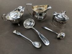 A GEORGIAN HALLMARKED SILVER CREAM JUG, AN EARLY 20th C. SAUCE BOAT, A MINIATURE TODDY LADLE, A