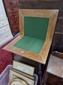 AN ARTS AND CRAFTS OAK SWIVEL TOP GAMES TABLE