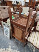 A SET OF THREE CANED OAK ARMCHAIRS