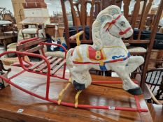 A VINTAGE TIN PLATE HORSE ROCKER.