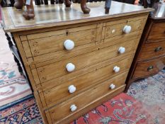 A VICTORIAN PAINTED PINE CHEST OF DRAWERS.