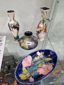 THREE MOORCROFT VASES AND AN OVAL BOWL IN VARIOUS PATTERNS