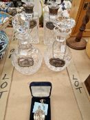 TWO PAIRS OF DECANTERS, EACH WITH SILVER BOTTLE LABELS, A SCENT BOTTLE WITH A FUNNEL TO FILL IT.