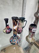 FOUR MOORCROFT VASES TOGETHER WITH ANOTHER WITH TWO HANDLES