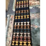 A SMALL FLAT WEAVE RUG.