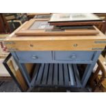 A BUTCHERS BLOCK ON A TWO DRAWER BASE WITH AN UNDERSHELF BETWEEN THE LEGS. W 102 x D 61 x H 91cms.