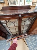 A MID 20th C. STAINED WOOD DISPLAY CABINET, THE BOW FRONT WITH GLAZED DOORS. W 92 x D 38 x H