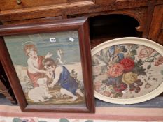 A VICTORIAN NEEDLEWORK PANEL IN MAHOGANY FRAME AND AN OVER FLORAL FRAMED TEXTILE.