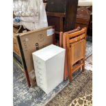 TWO UNUSED WHITE BOARDS, A SMALL SIX DRAWER STEEL CABINET AND FOUR FOLDING CHAIRS