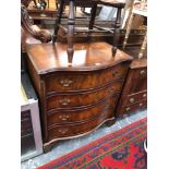 A WALNUT VENEER FOUR DRAWER SMALL CHEST.