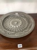 AN 18th C. PEWTER DISH WORKED WITH A CENTRAL ROSETTE IN RELIEF, ONE TOUCH MARK INSCRIBED RAYMOND.