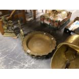 A PAIR OF CHINESE BRASS DISHES, TWO BRASS LION DOOR STOPS TOGETHER WITH A BRASS COAL SCUTTLE