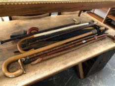 A LARGE COLLECTION OF ANTIQUE AND VINTAGE WALKING STICKS