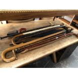 A LARGE COLLECTION OF ANTIQUE AND VINTAGE WALKING STICKS