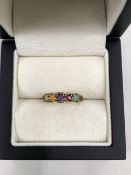 A 9ct HALLMARKED GOLD AND GEMSET CHANNEL SET RING. WEIGHT 1.76grms
