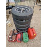 FIVE TYRES AND WHEELS FOR A MG MIDGET, TOGETHER WITH VARIOUS FUEL CANS.