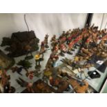 A COLLECTION OF ELASTOLIN BRITISH SOLDIERS, COWBOYS AND INDIANS