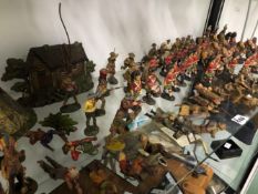 A COLLECTION OF ELASTOLIN BRITISH SOLDIERS, COWBOYS AND INDIANS