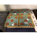 A SET OF TWELVE MAWS TILES DECORATED WITH FIVE RED ROSETTES ON TURQUOISE VINES