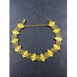 AN EASTERN ZODIAC SYMBOL FILIGREE WORK BRACELET. UNHALLMARKED, ASSESSED AS 17ct GOLD. WEIGHT 11.