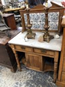 AN EDWARDIAN ASH WASH STAND WITH TILE BACK.