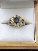 A 9ct HALLMARKED GOLD BLUE SAPPHIRE AND CITRINE RING, FINGER SIZE K WEIGHT 4.13grms