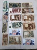 SIXTEEN VARIOUS WORLD BANK NOTES TO INCLUDE A TEN SHILLINGS AND ONE POUND EXAMPLE.