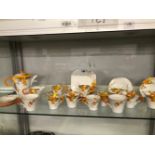A SHELLEY TEA SET DECORATED WITH ORANGE AND YELLOW DAISIES