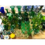 A COLLECTION OF GREEN GLASS, TO INCLUDE DRINKING GLASS, DECANTERS AND VASES