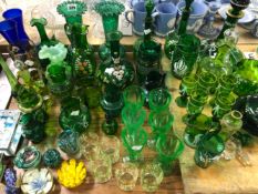 A COLLECTION OF GREEN GLASS, TO INCLUDE DRINKING GLASS, DECANTERS AND VASES