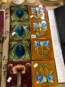 EIGHT TILES DECORATED IN THE ART NOUVEAU TASTE