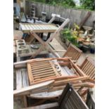 A HARDWOOD PATIO TABLE AND CHAIRS WITH A DRINKS TROLLEY