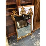 A GEORGIAN STYLE GILT FRAMED WALL MIRROR