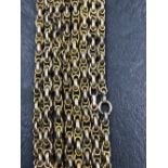 A 20th CENTURY LONG GUARD MUFF CHAIN. LENGTH 152cms. UNHALLMARKED, ASSESSED AS 9ct GOLD. WEIGHT 33.