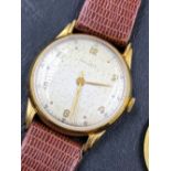 A VINTAGE LONGINES WRIST WATCH, THE INSIDE CASE STAMPED 18K 750. THE WATCH IS CURRENTLY WORKING