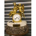 A PARIS ORMOLU AND MARBLE MANTEL CLOCK STRIKING ON A BELL BEARING AN 1859 LABEL RELATING TO IT