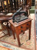 AN ANTIQUE BOOK PRESS ON STAND