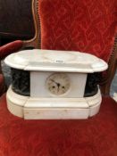 A WHITE MARBLE CASED CLOCK THE PENDULUM MOVEMENT TO COUNTWHEEL STRIKE ON A BELL, THE CASE. W 39cms.