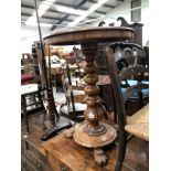 A MAHOGANY LAMP TABLE WITH CARVED FEET