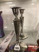 A PAIR OF WALKER AND HALL SILVER CANDLESTICKS OF HEXAGONAL SECTION.